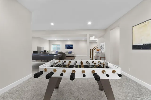 a kitchen with stainless steel appliances kitchen island granite countertop a stove and a sink