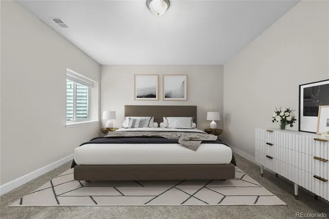 a bedroom with a bed and window