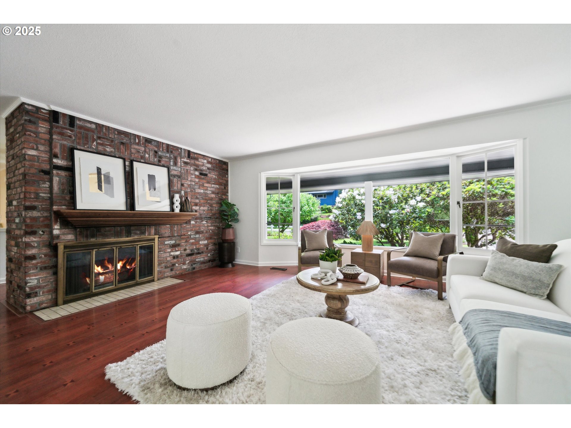 0501 South Riverside Street Portland, OR 97219 - Photo 13 of 45 a living room with furniture a fireplace and a large window
