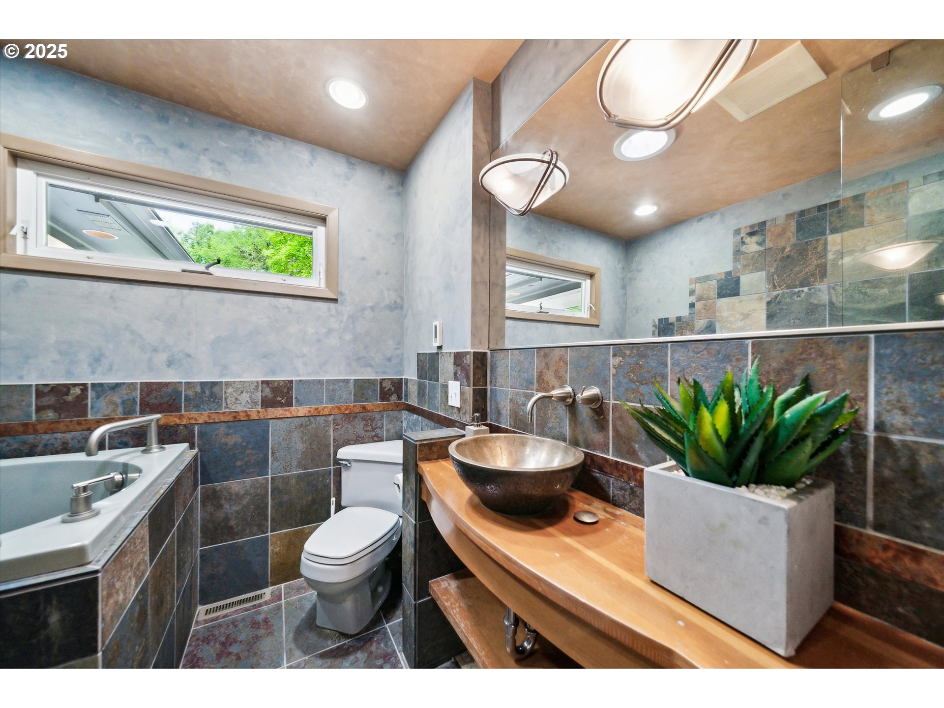0501 South Riverside Street Portland, OR 97219 - Photo 15 of 45 a bathroom with a potted plant and a sink