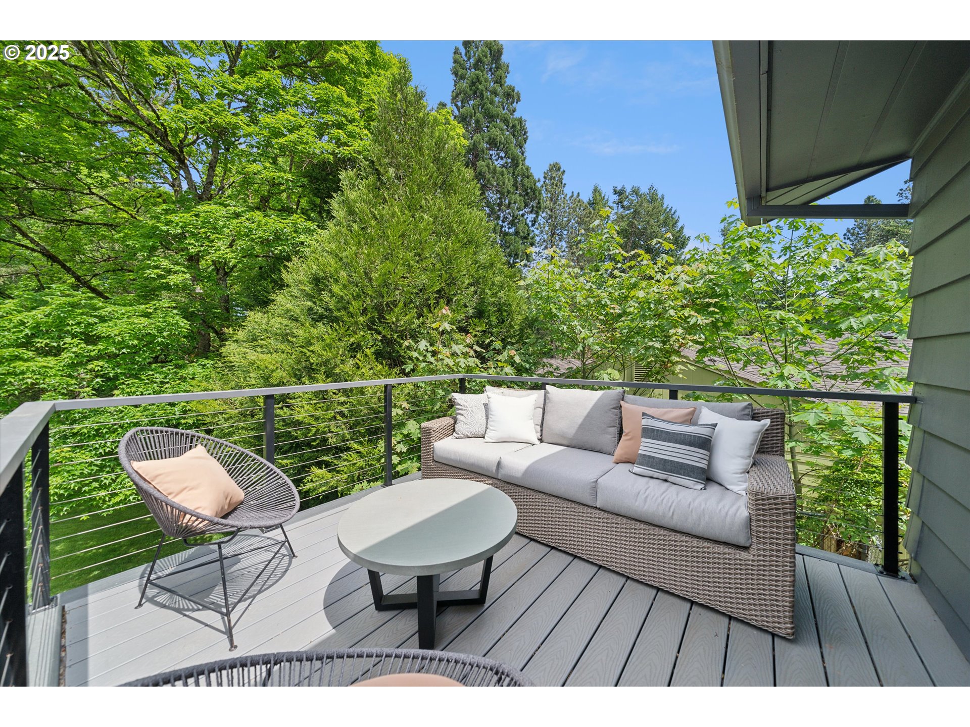 0501 South Riverside Street Portland, OR 97219 - Photo 19 of 45 a balcony with wooden floor and outdoor seating