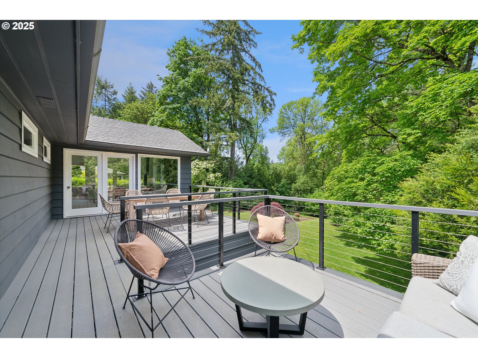 0501 South Riverside Street Portland, OR 97219 - Photo 20 of 45 a view of a patio with a dining table and chairs with wooden floor