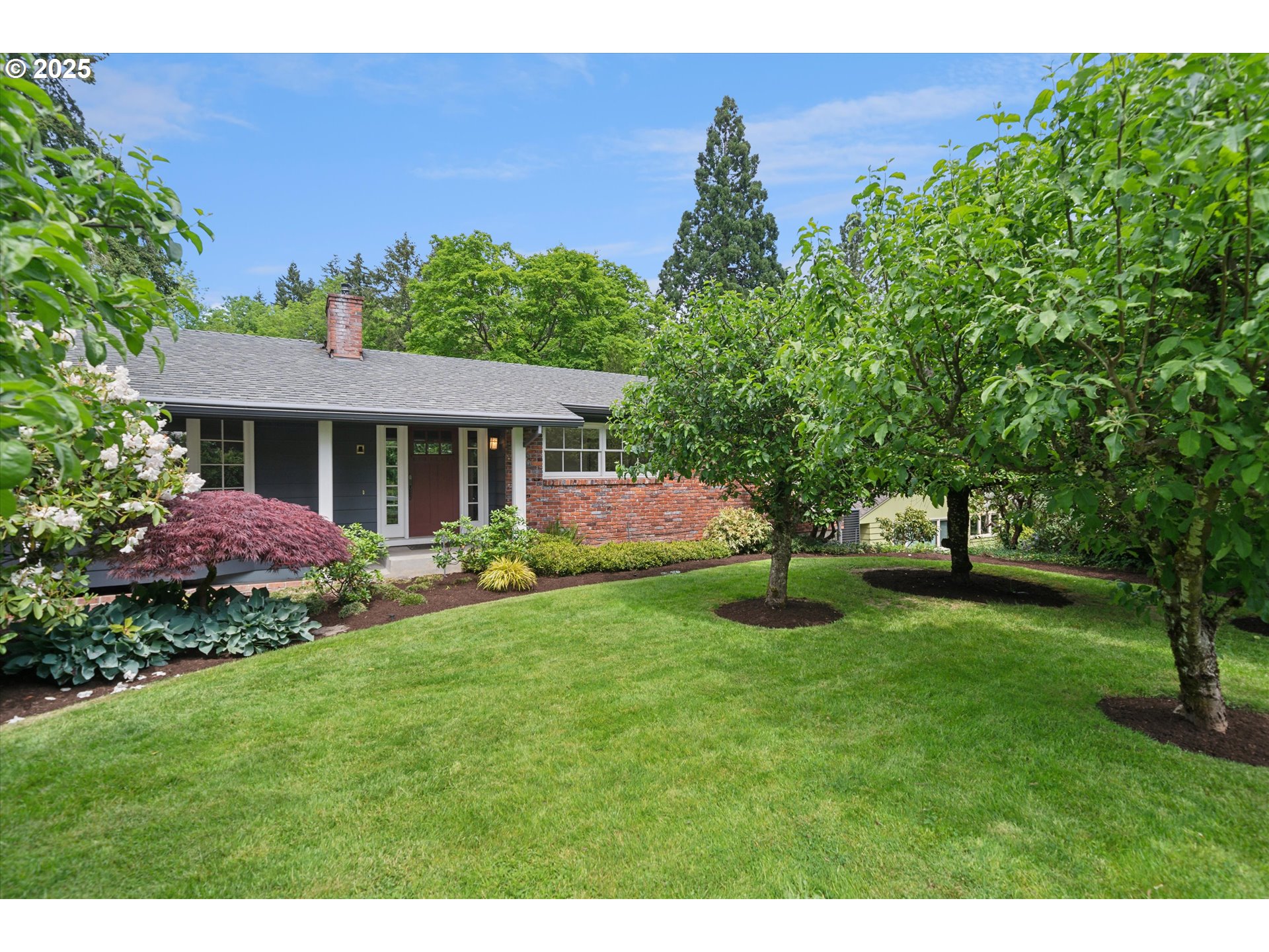 0501 South Riverside Street Portland, OR 97219 - Photo 2 of 45 a view of a house with a yard and a tree