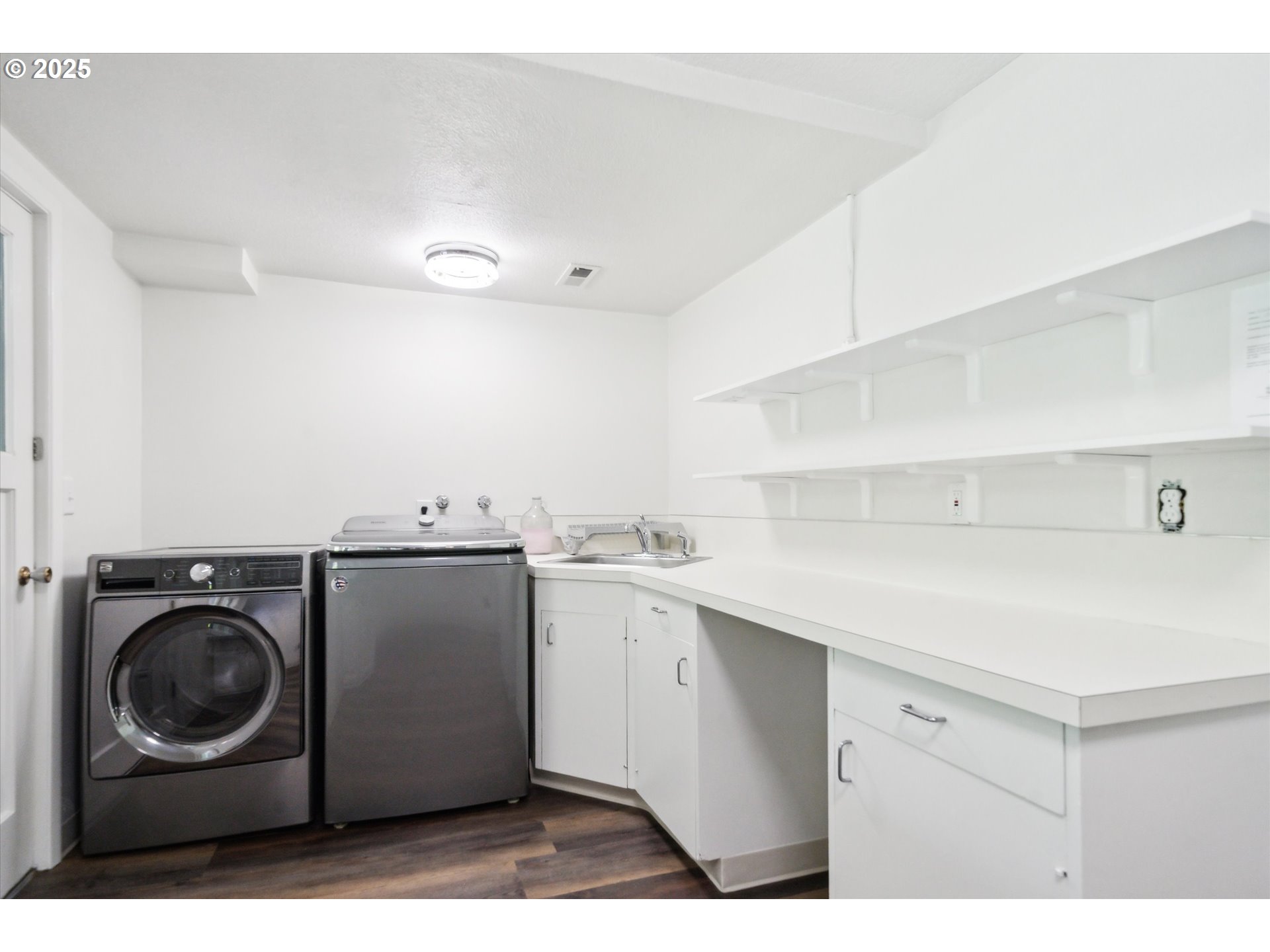 0501 South Riverside Street Portland, OR 97219 - Photo 31 of 45 a utility room with sink dryer and washer