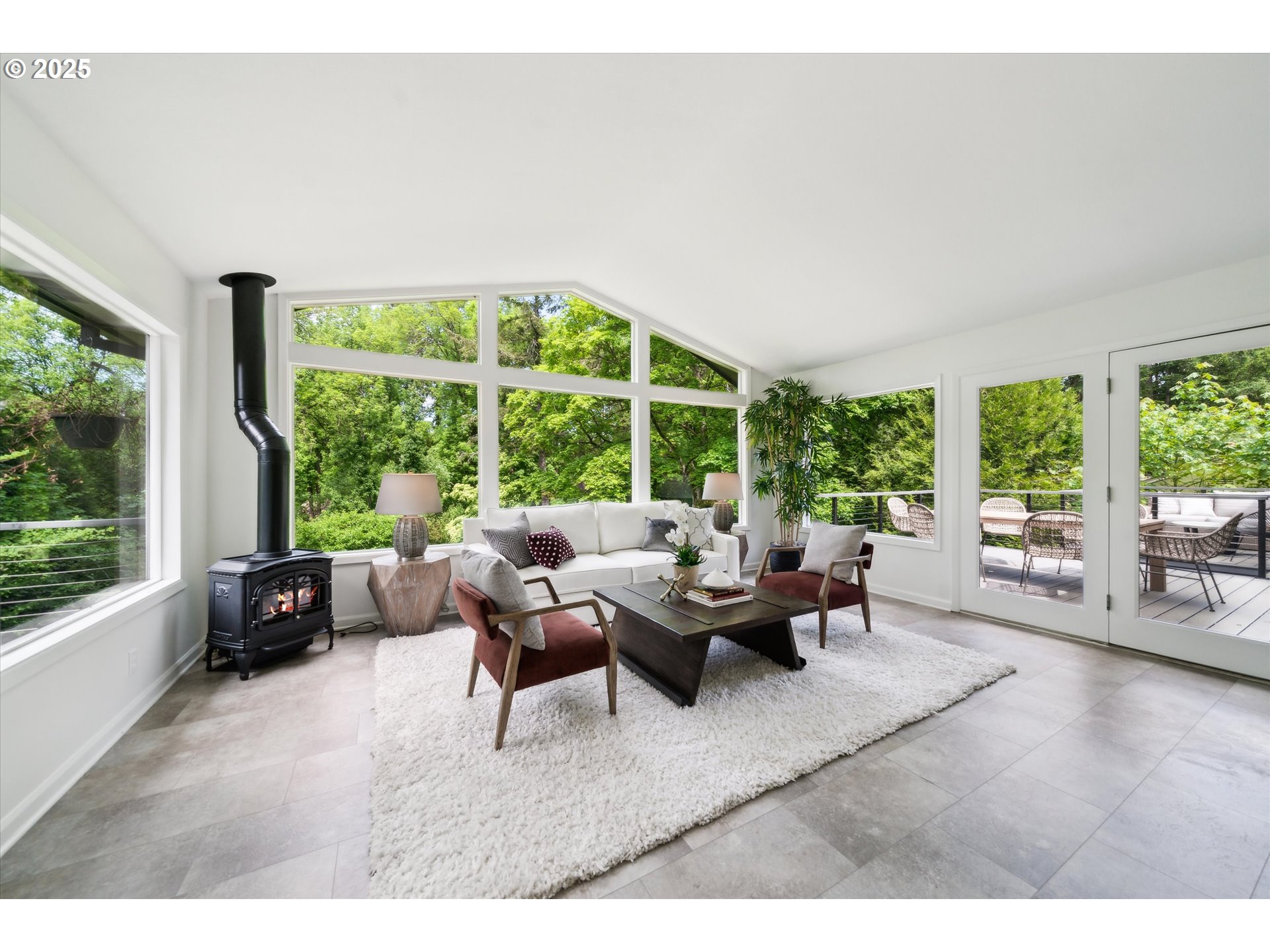0501 South Riverside Street Portland, OR 97219 - Photo 4 of 45 a living room with furniture and large windows