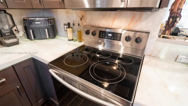 a view of dining room with furniture and a floor to ceiling window