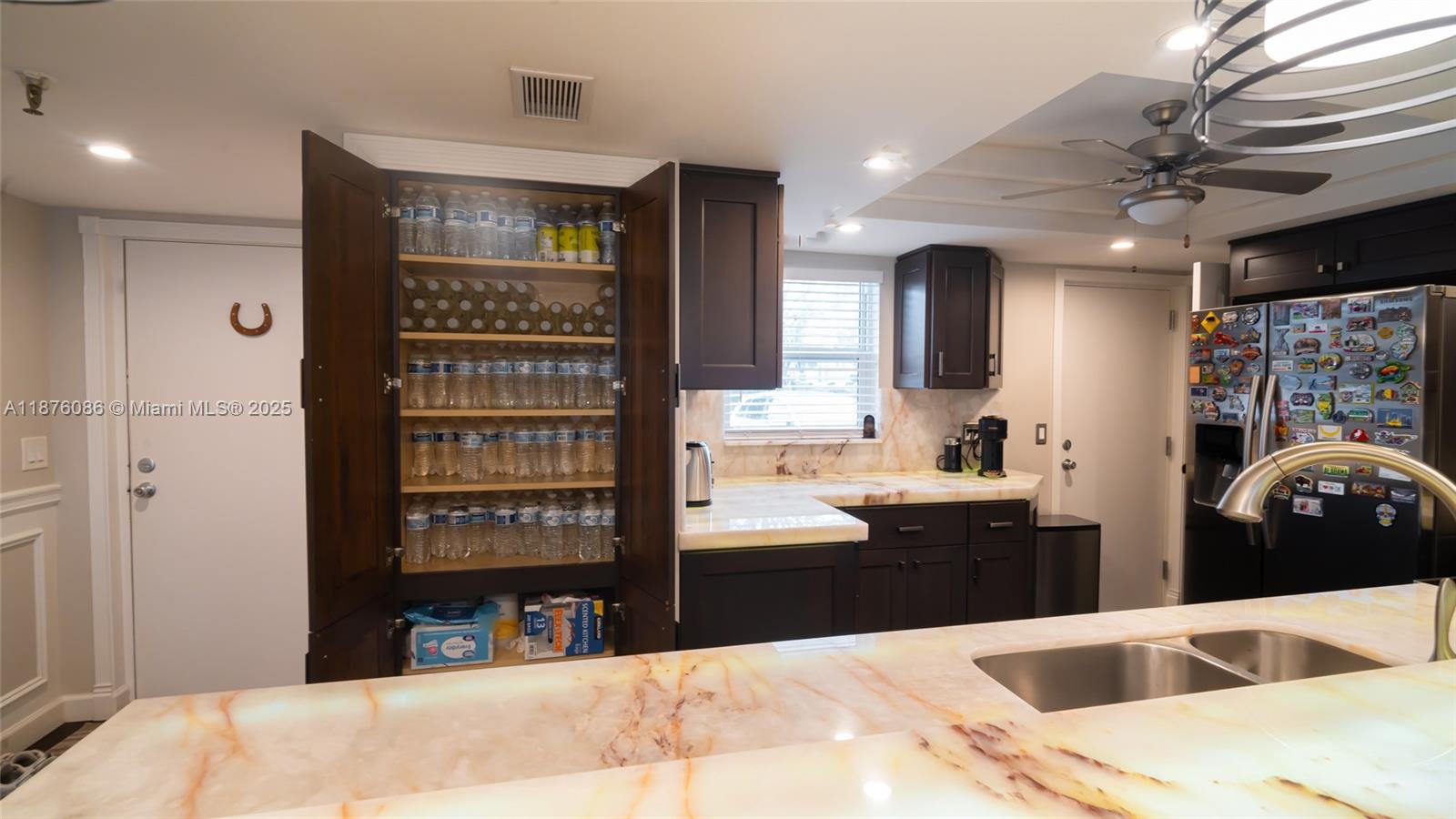 6500 Northwest 2nd Avenue, Unit 114 Boca Raton, FL 33487 - Photo 14 of 71 a view of kitchen with stainless steel appliances kitchen island a refrigerator sink and stove