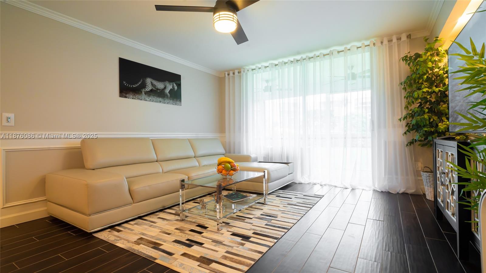 6500 Northwest 2nd Avenue, Unit 114 Boca Raton, FL 33487 - Photo 2 of 71 a living room with furniture and a large window