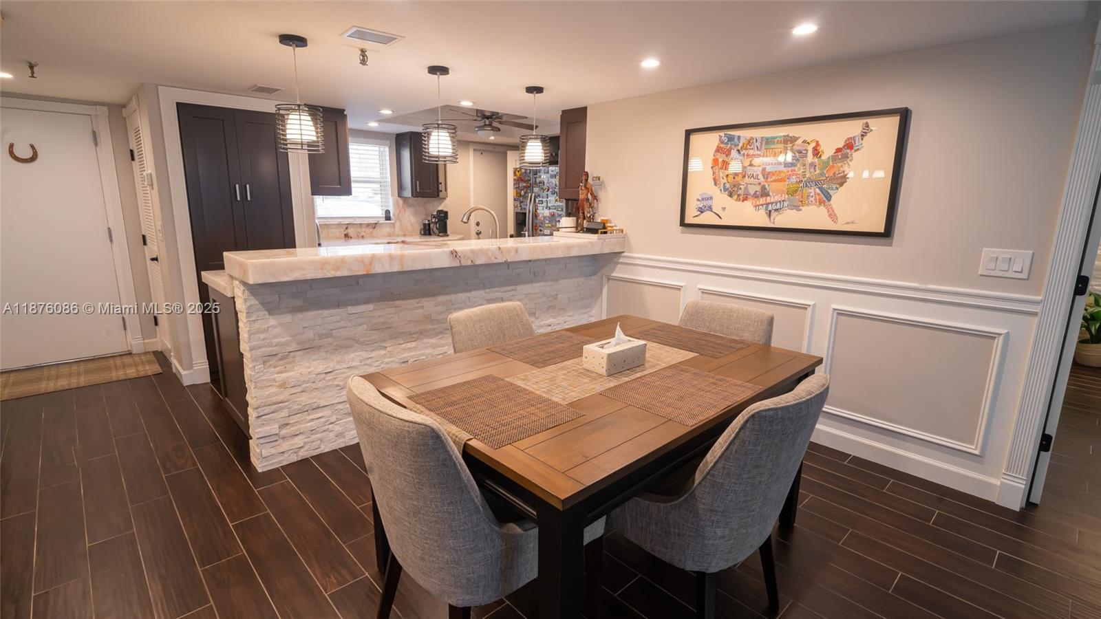 6500 Northwest 2nd Avenue, Unit 114 Boca Raton, FL 33487 - Photo 22 of 71 a dining room with furniture and wooden floor