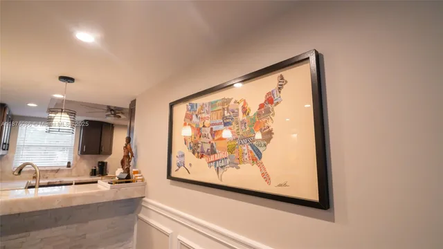 a bedroom with a bed and a flat tv screen on dresser