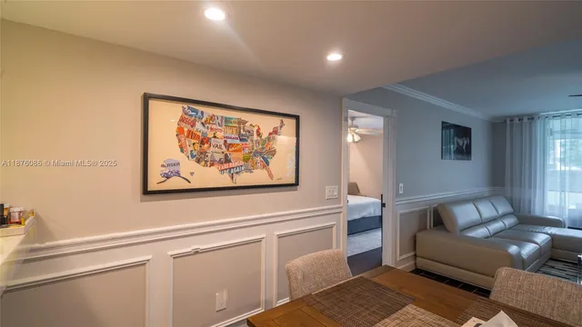 a bedroom with a bed and a mirror on dresser