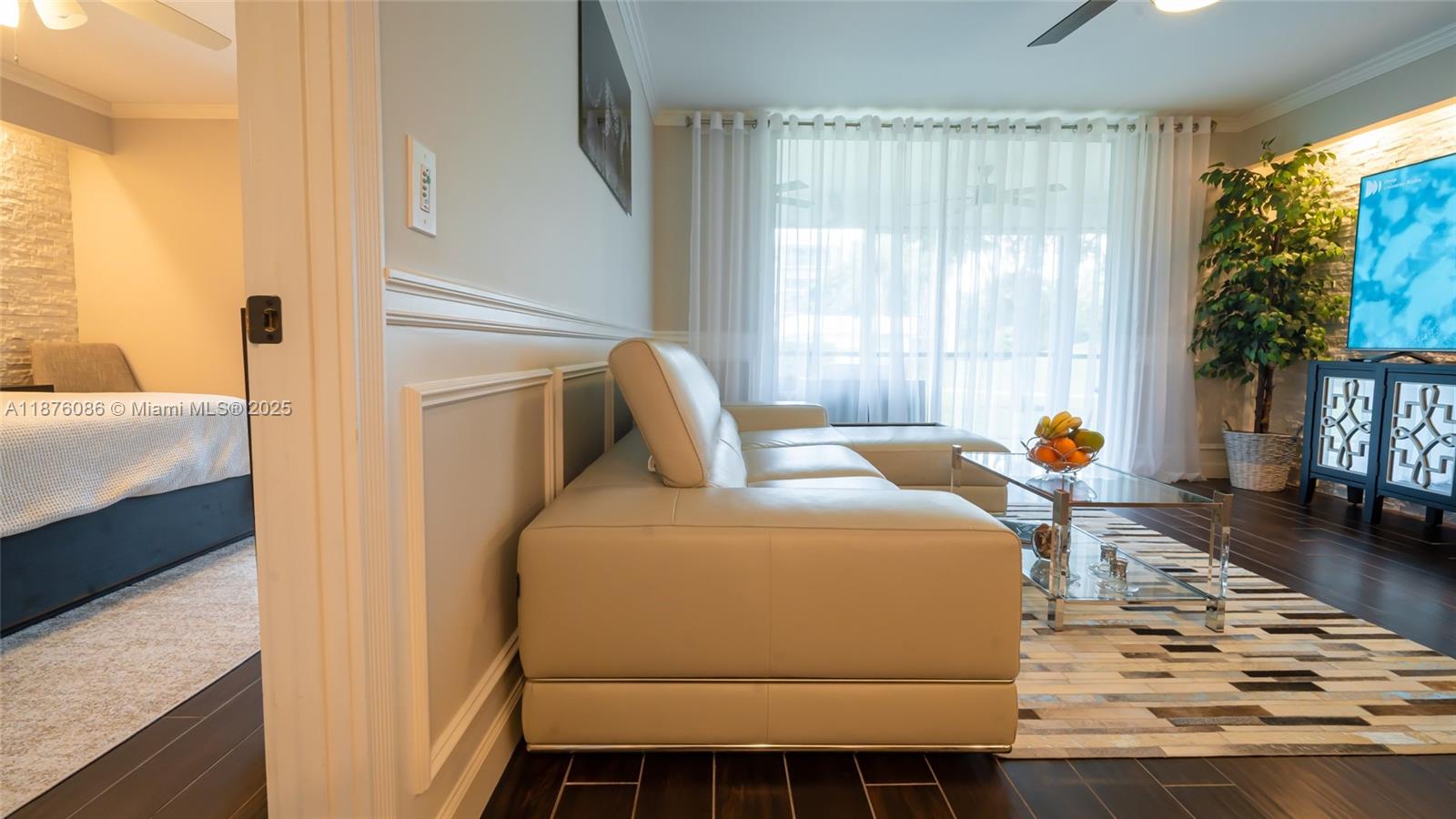 6500 Northwest 2nd Avenue, Unit 114 Boca Raton, FL 33487 - Photo 3 of 71 a bedroom with a bed and a window