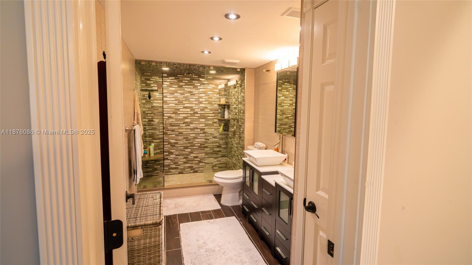 6500 Northwest 2nd Avenue, Unit 114 Boca Raton, FL 33487 - Photo 34 of 71 a bathroom with a shower and a toilet