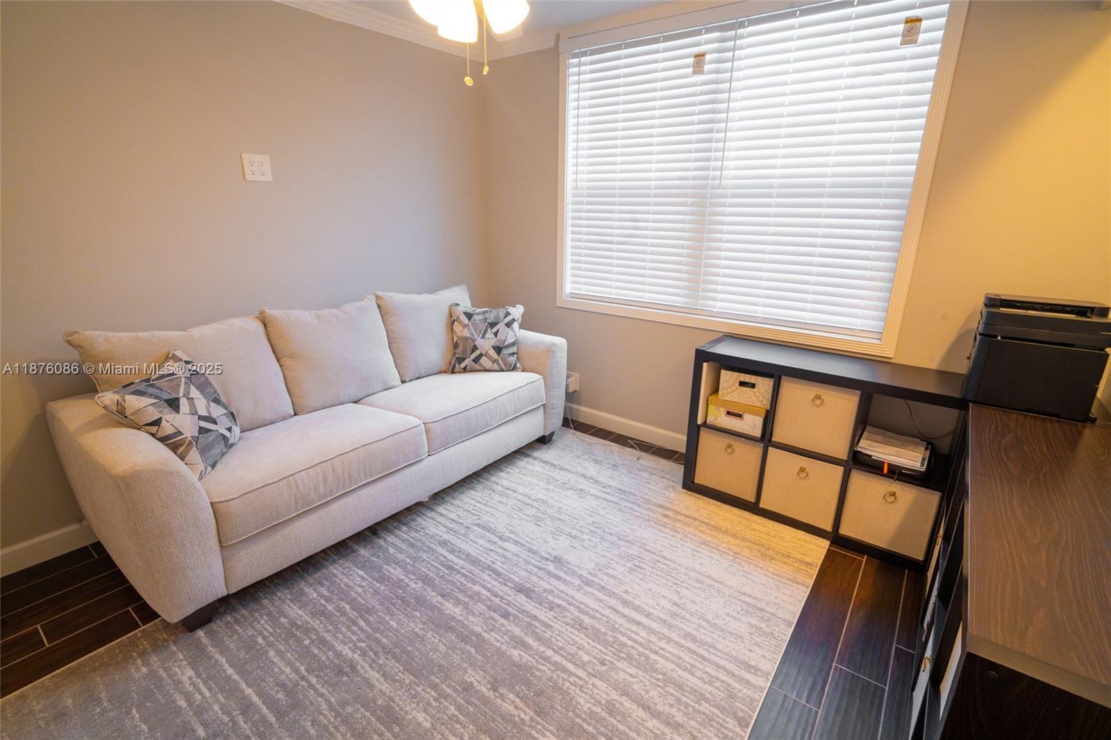 6500 Northwest 2nd Avenue, Unit 114 Boca Raton, FL 33487 - Photo 39 of 71 a living room with furniture and a window