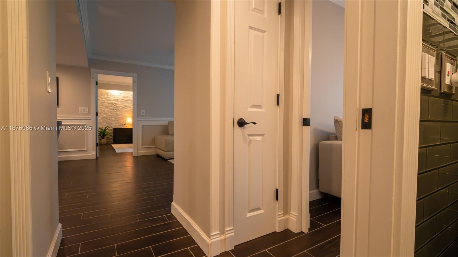 6500 Northwest 2nd Avenue, Unit 114 Boca Raton, FL 33487 - Photo 44 of 71 a view of a hallway with wooden floor and staircase