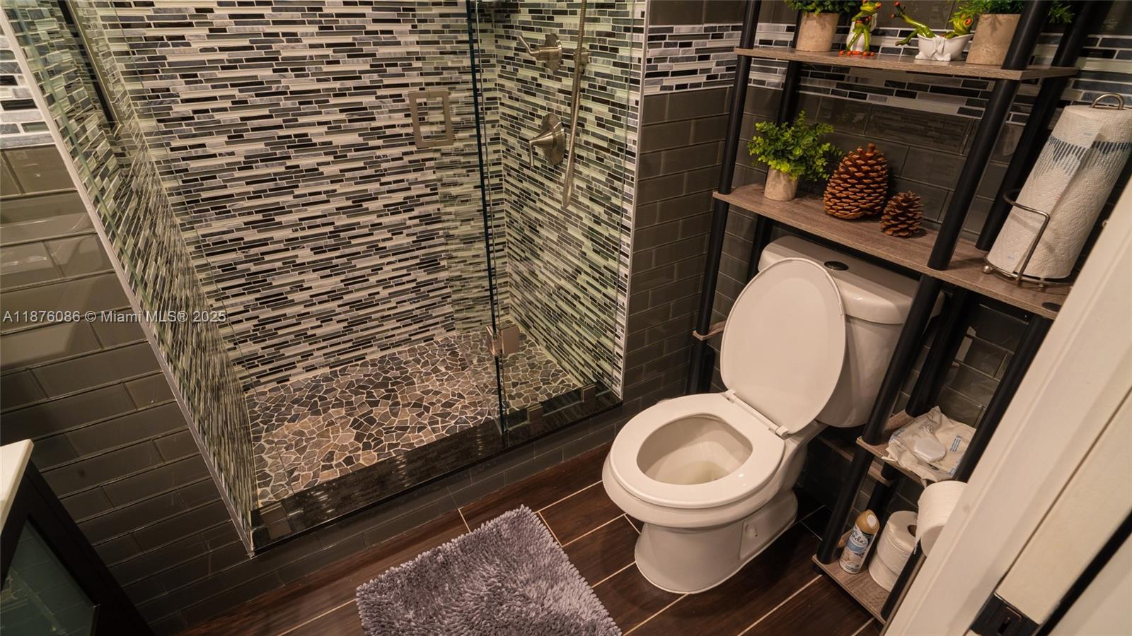 6500 Northwest 2nd Avenue, Unit 114 Boca Raton, FL 33487 - Photo 48 of 71 a bathroom with a toilet and a sink