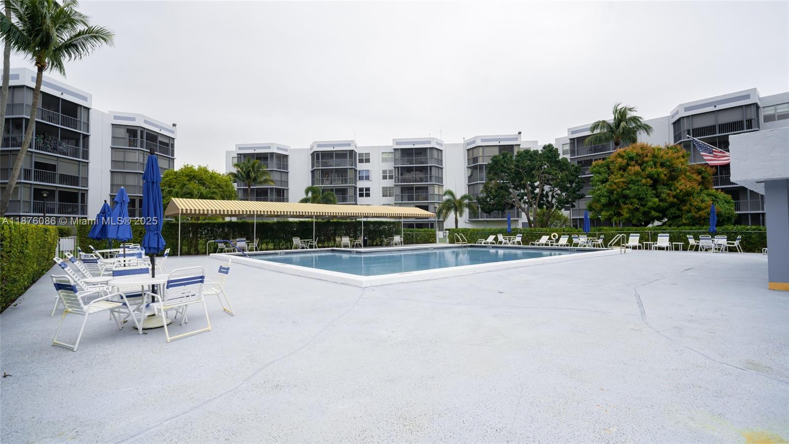 6500 Northwest 2nd Avenue, Unit 114 Boca Raton, FL 33487 - Photo 65 of 71 a view of swimming pool with outdoor seating and plants