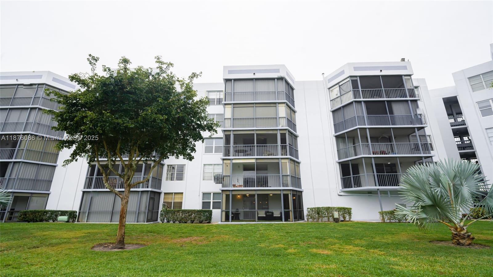 6500 Northwest 2nd Avenue, Unit 114 Boca Raton, FL 33487 - Photo 66 of 71 a front view of building with yard