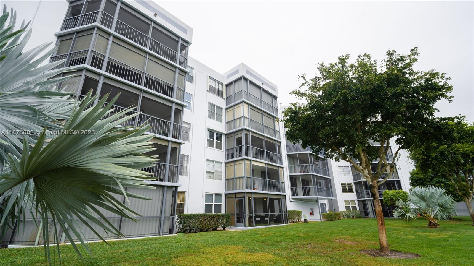 6500 Northwest 2nd Avenue, Unit 114 Boca Raton, FL 33487 - Photo 67 of 71 a view of a building with a yard