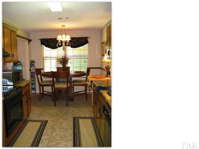 Kitchen has been updated with ceramic tile flooring, new laminate counter tops, and new cabinet hardware.