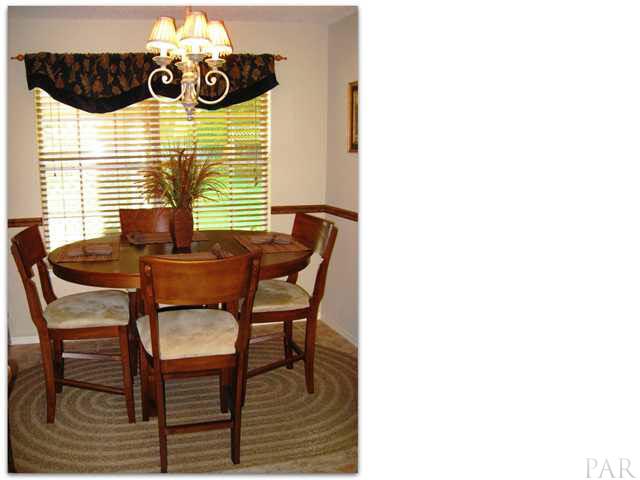 Eat-in kitchen with elegant chandelier