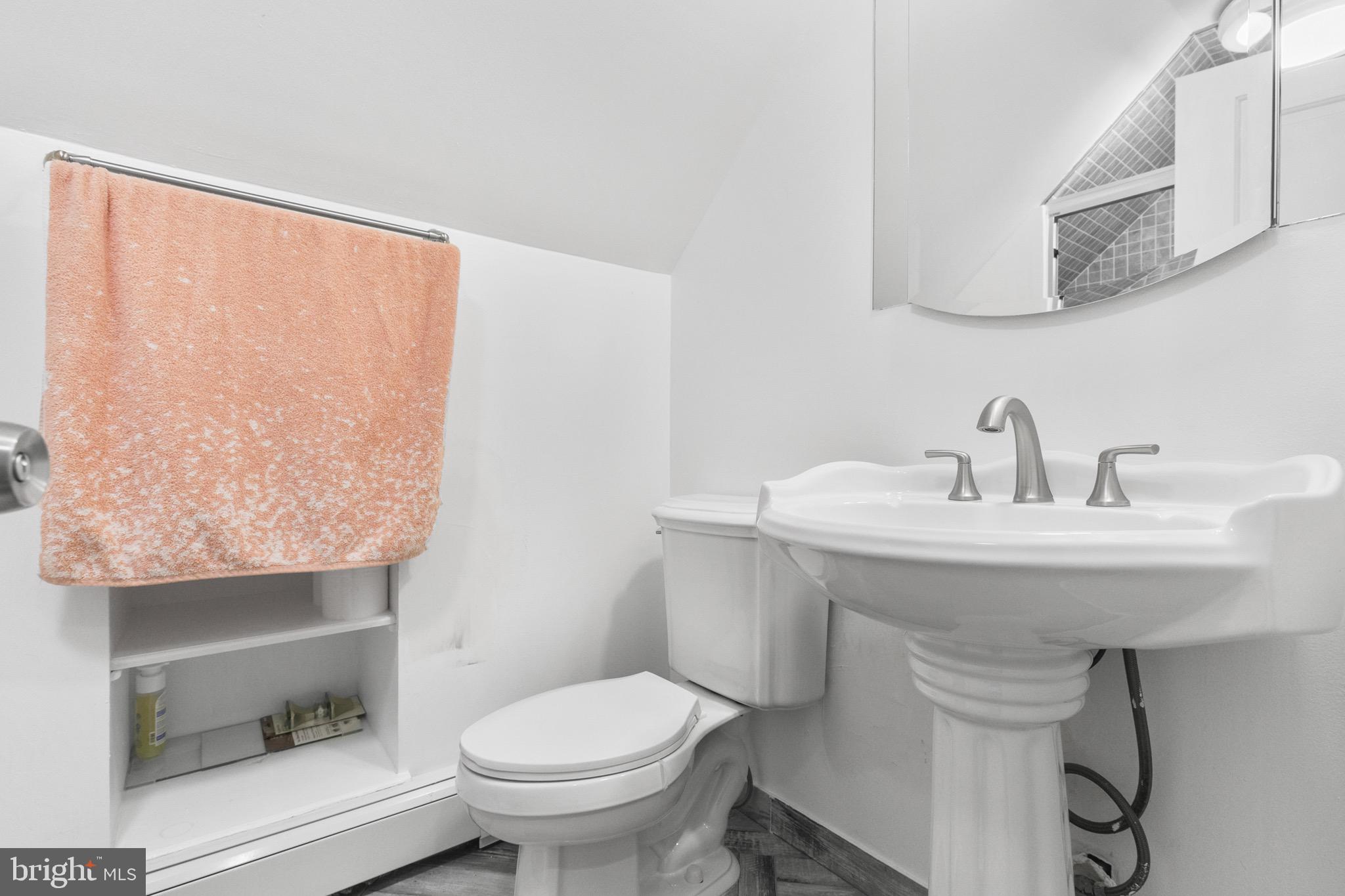 68 Shawmont Lane Willingboro, NJ 08046 - Photo 22 of 25 a bathroom with a sink toilet and mirror