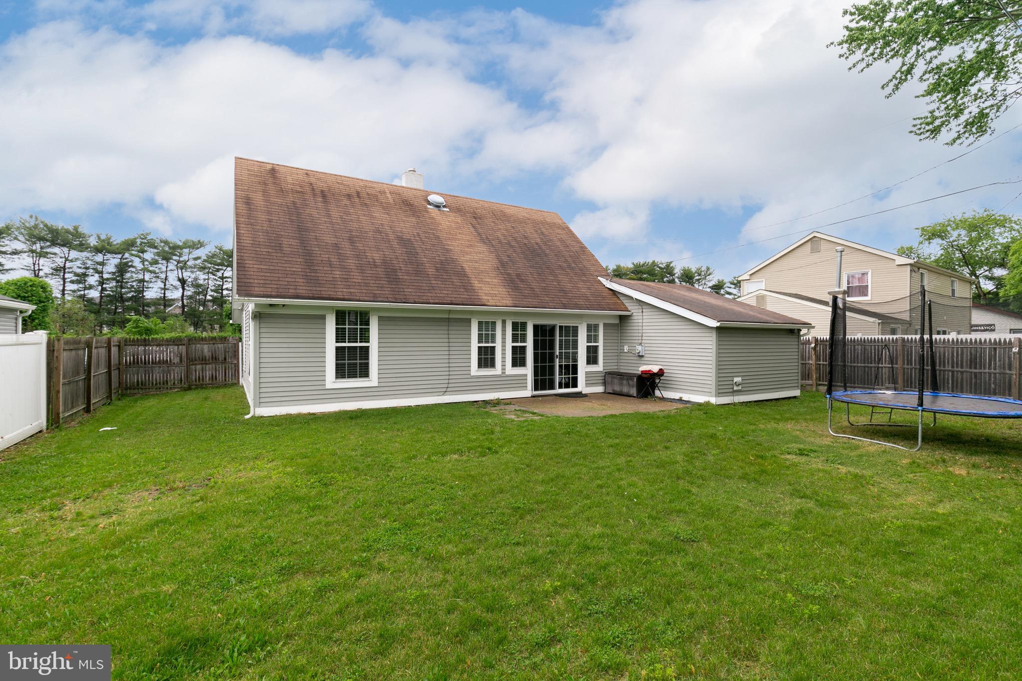 68 Shawmont Lane Willingboro, NJ 08046 - Photo 24 of 25 a front view of a house with a garden