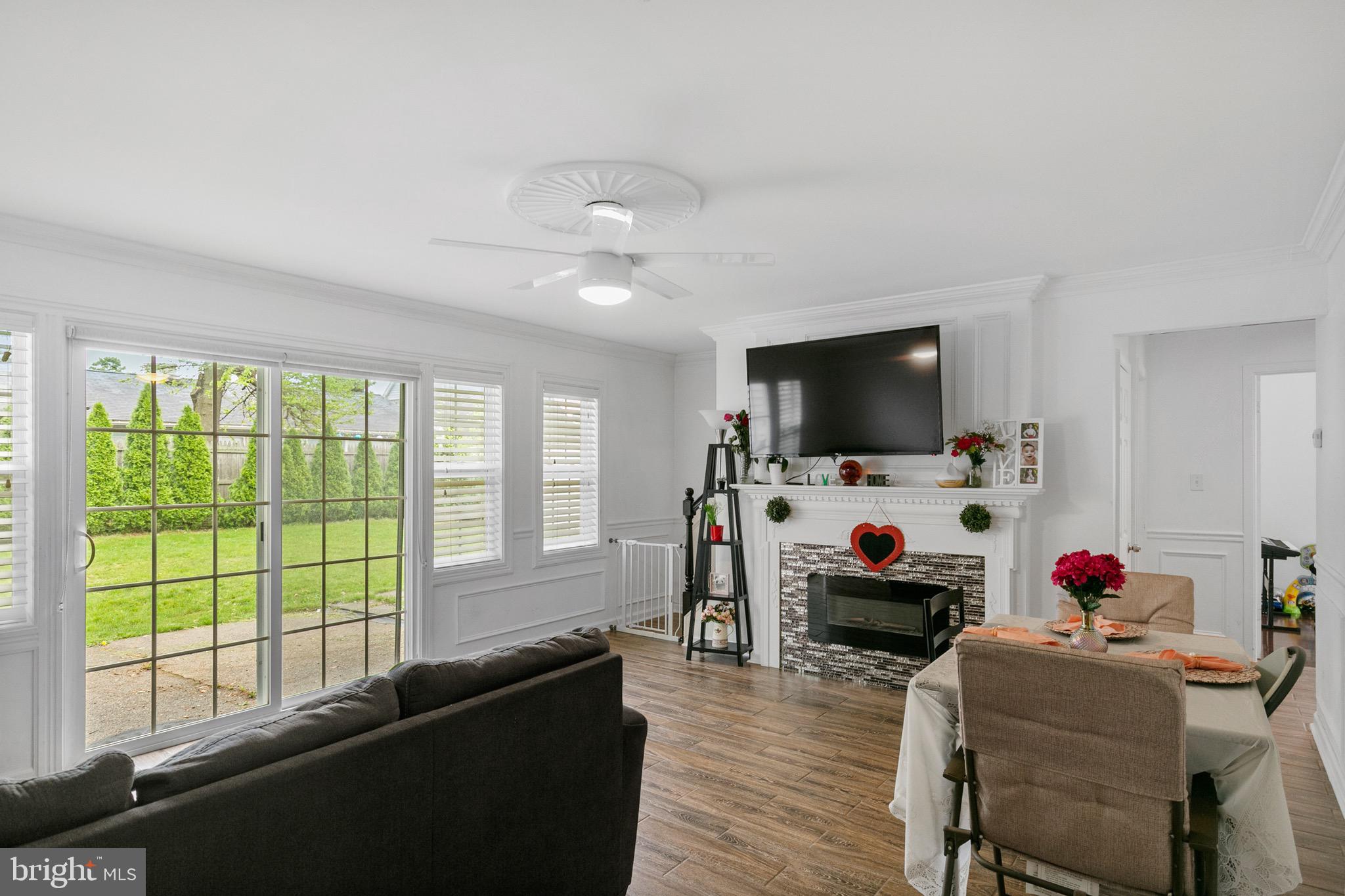 68 Shawmont Lane Willingboro, NJ 08046 - Photo 6 of 25 a living room with furniture and a flat screen tv