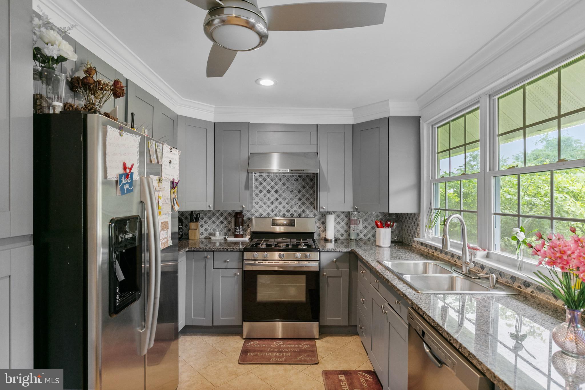 68 Shawmont Lane Willingboro, NJ 08046 - Photo 9 of 25 a kitchen with stainless steel appliances granite countertop a stove and a refrigerator