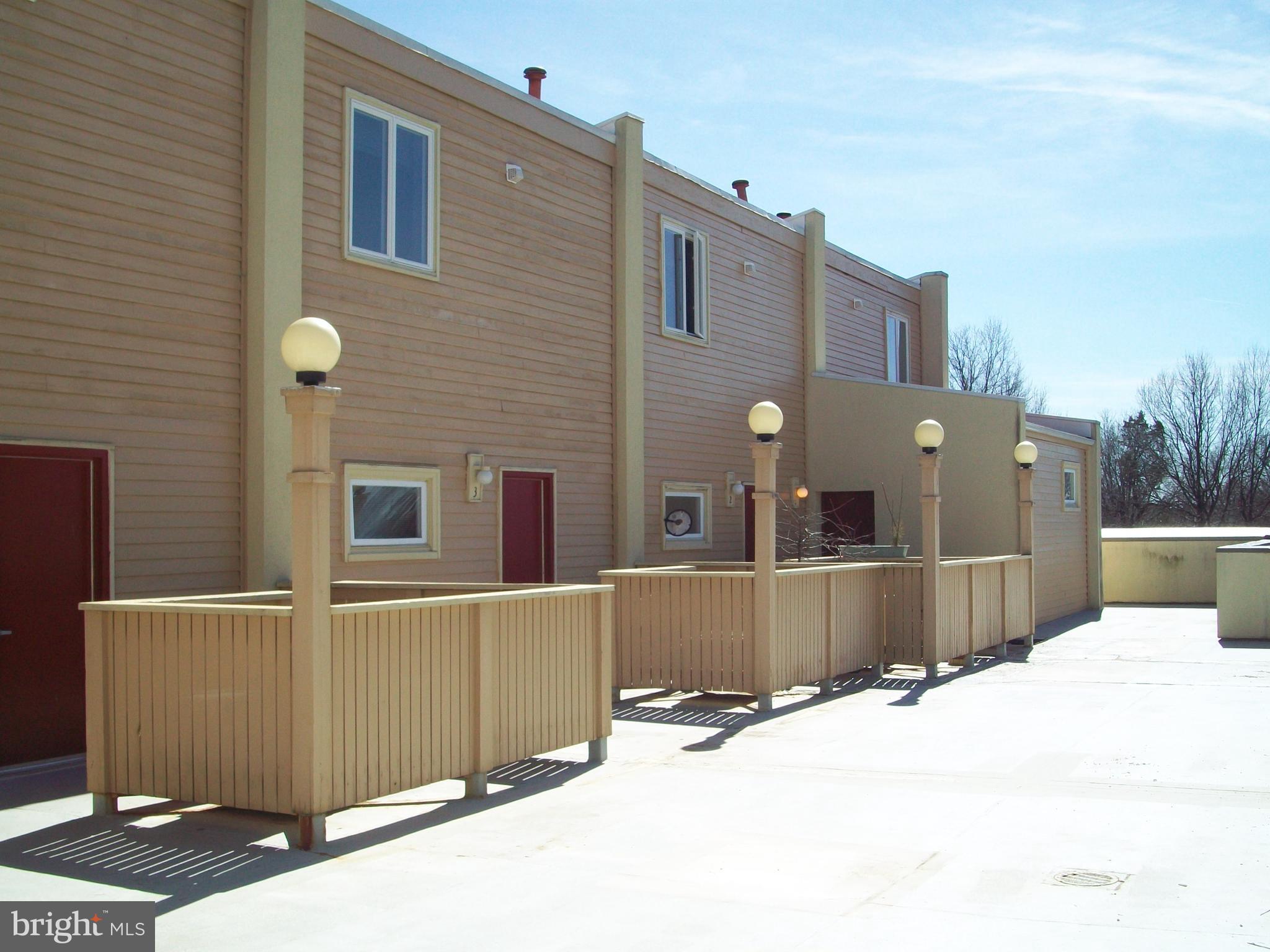 5485 Harpers Farm Road, Unit L6 Columbia, MD 21044 - Photo 1 of 20 a house view with a outdoor space