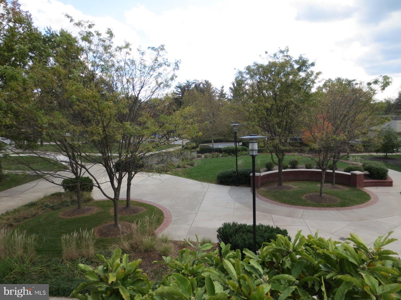 5485 Harpers Farm Road, Unit L6 Columbia, MD 21044 - Photo 15 of 20 a backyard of a house with a yard and outdoor seating
