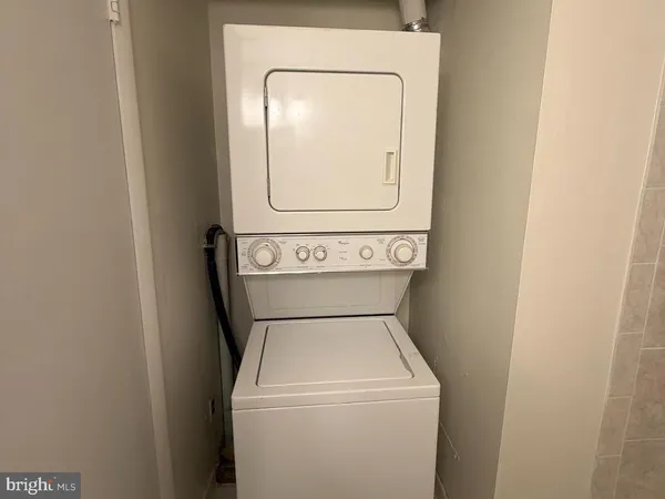 a backyard of a house with a yard and outdoor seating