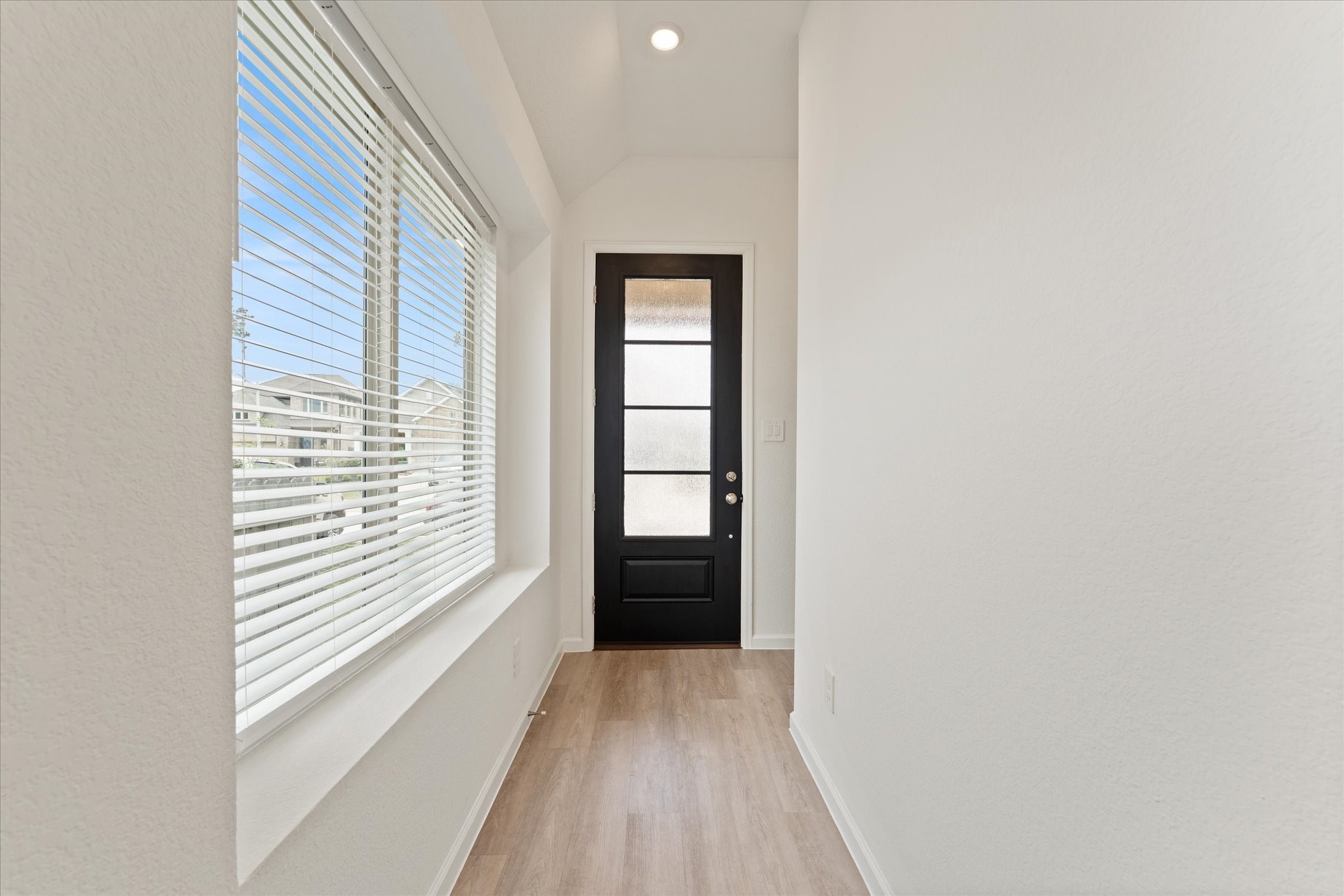 15520 Sunset Maple Court Conroe, TX 77302 - Photo 4 of 46 a view of an empty room with a window
