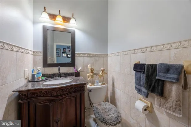 a living room with furniture a fireplace and a floor to ceiling window