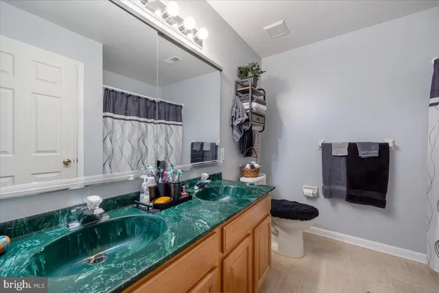 a bedroom with a bed and a chair