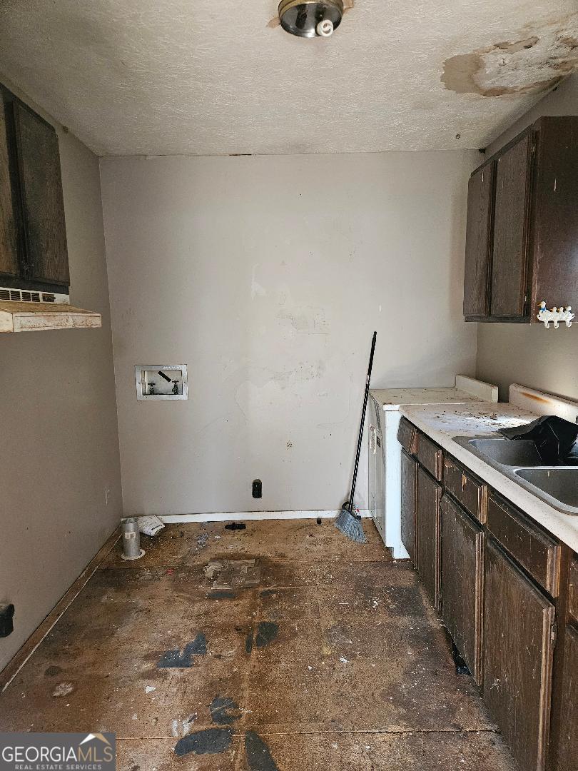 914 Chubbtown Road Cedartown, GA 30125 - Photo 6 of 11 a view of a kitchen with sink and washing machine