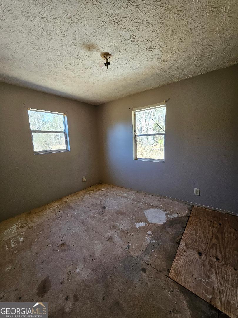 914 Chubbtown Road Cedartown, GA 30125 - Photo 9 of 11 a view of a bedroom with a window
