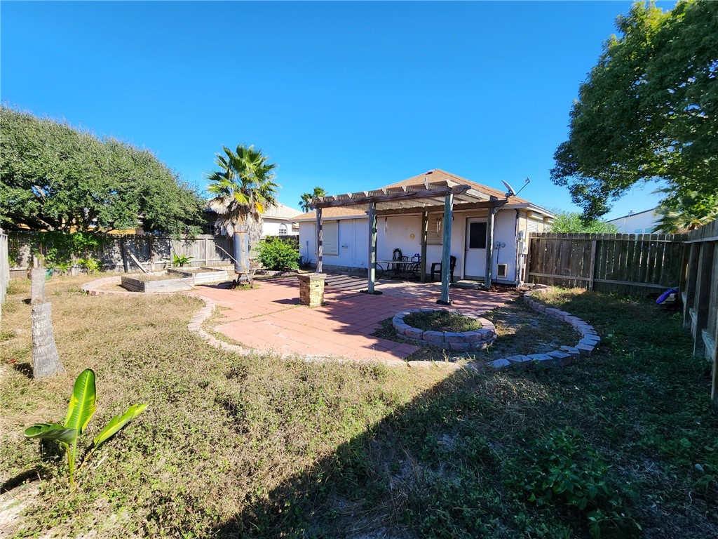 14721 Lighthouse Drive Corpus Christi, TX 78418 - Photo 13 of 17 a view of a backyard with sitting area