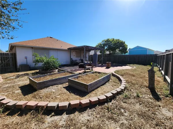 a view of a house with swimming pool and furniture