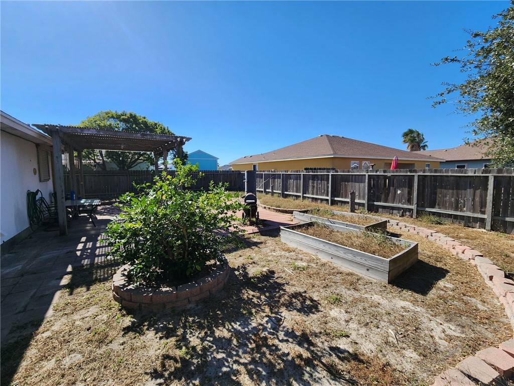 14721 Lighthouse Drive Corpus Christi, TX 78418 - Photo 15 of 17 a view of a house with a yard