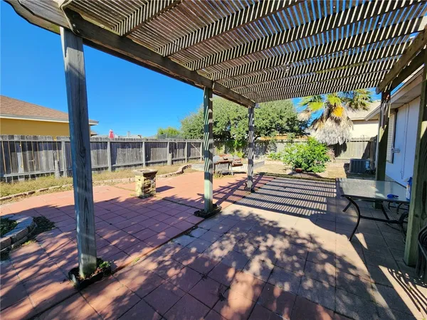 a view of a swimming pool with a patio