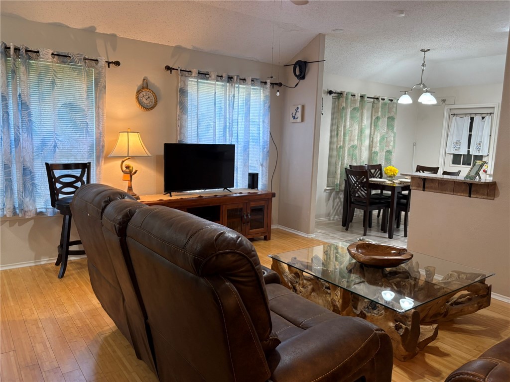 14721 Lighthouse Drive Corpus Christi, TX 78418 - Photo 3 of 17 a living room with furniture and a flat screen tv