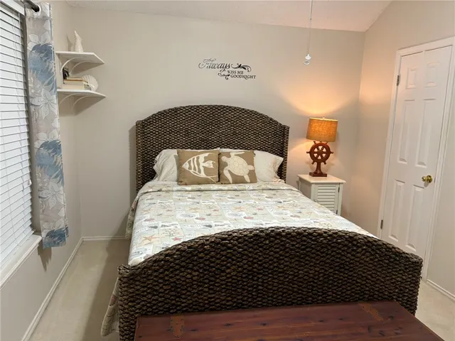 a bedroom with a bed and a cabinets