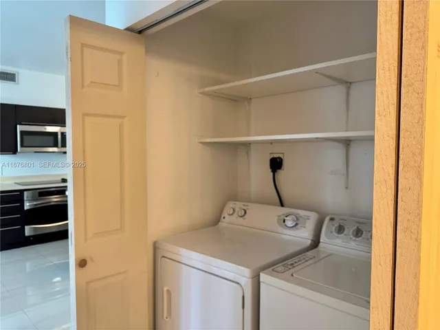 a utility room with dryer and washer