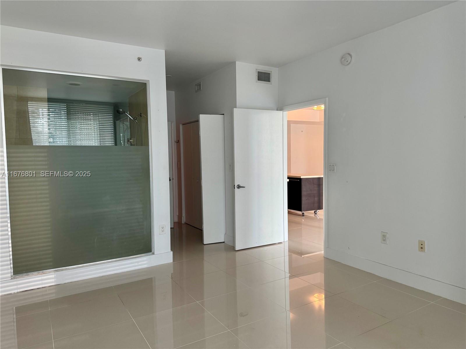 90 Southwest 3rd Street, Unit 1416 Miami, FL 33130 - Photo 24 of 31 a view of a bathroom with a shower