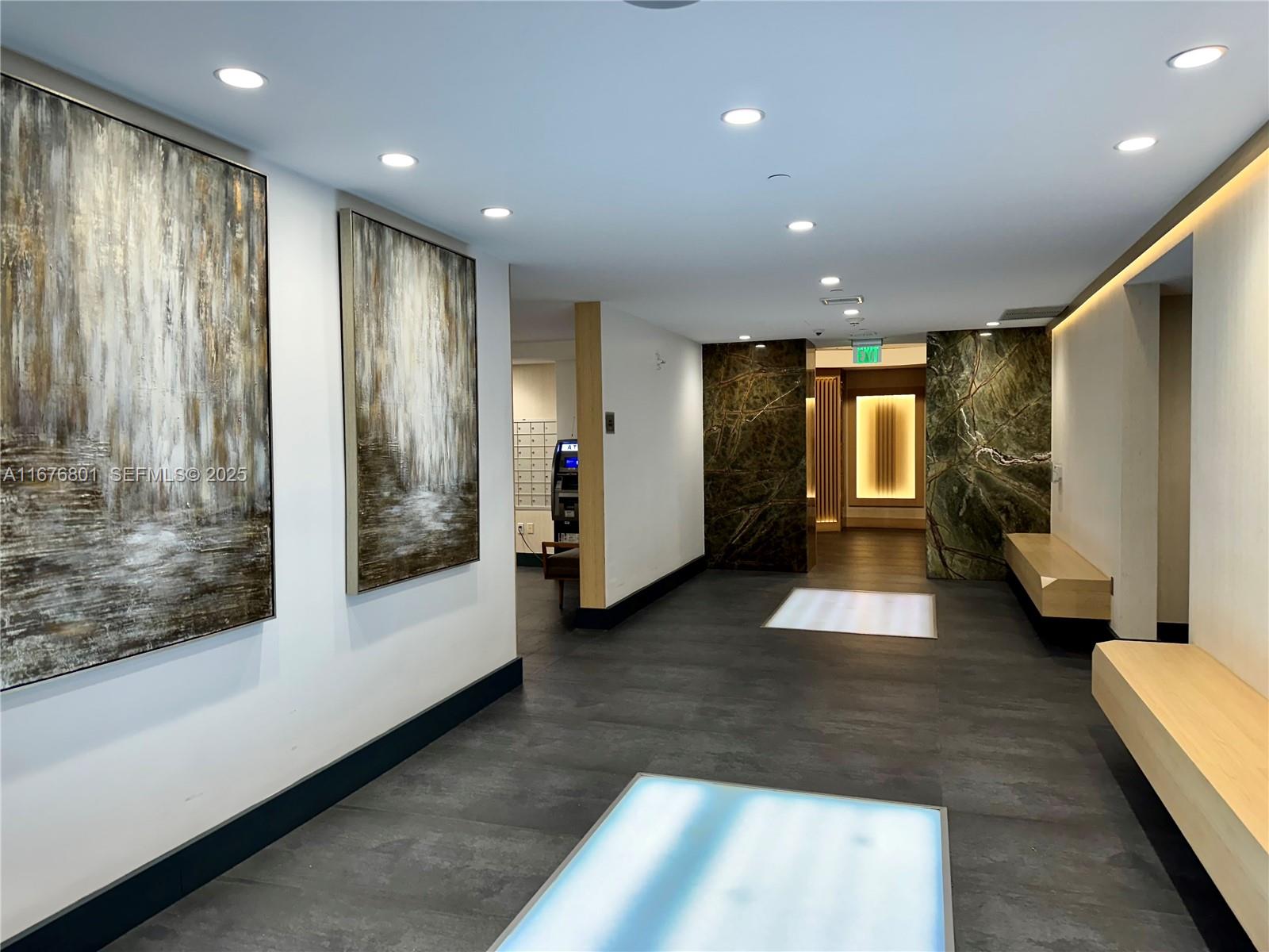 90 Southwest 3rd Street, Unit 1416 Miami, FL 33130 - Photo 3 of 31 a view of entryway with wooden floor and garden