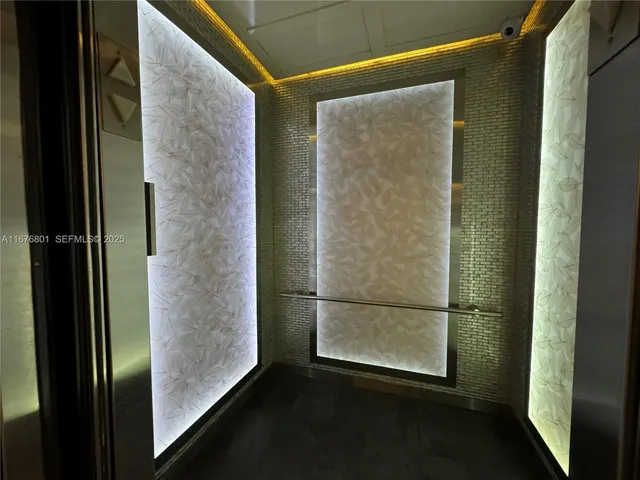 a bathroom with a glass door