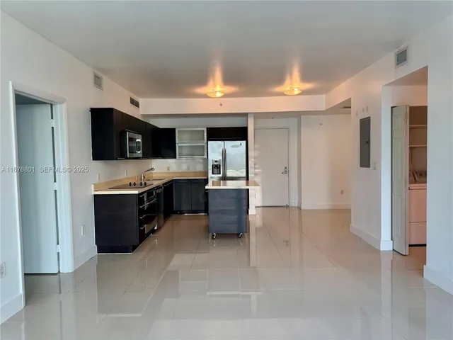 a view of living room with furniture and flat screen tv