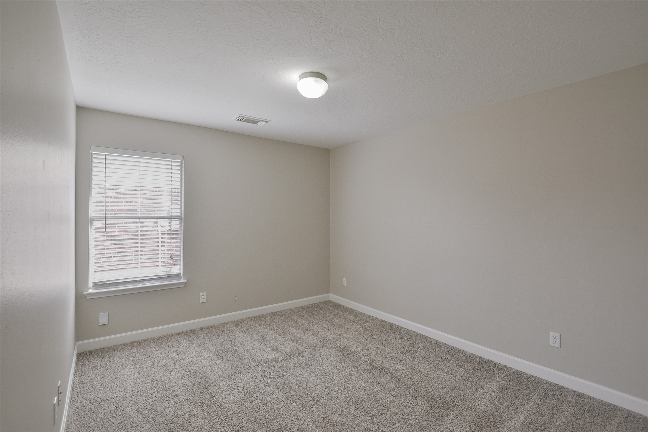 13027 Lark Point Court Houston, TX 77044 - Photo 19 of 29 an empty room with a window