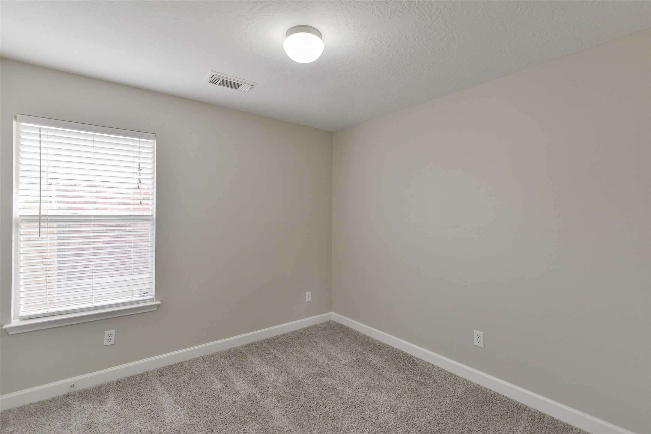 13027 Lark Point Court Houston, TX 77044 - Photo 21 of 29 an empty room with a window